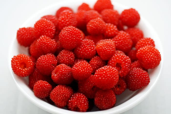 raspberries in a white bowl