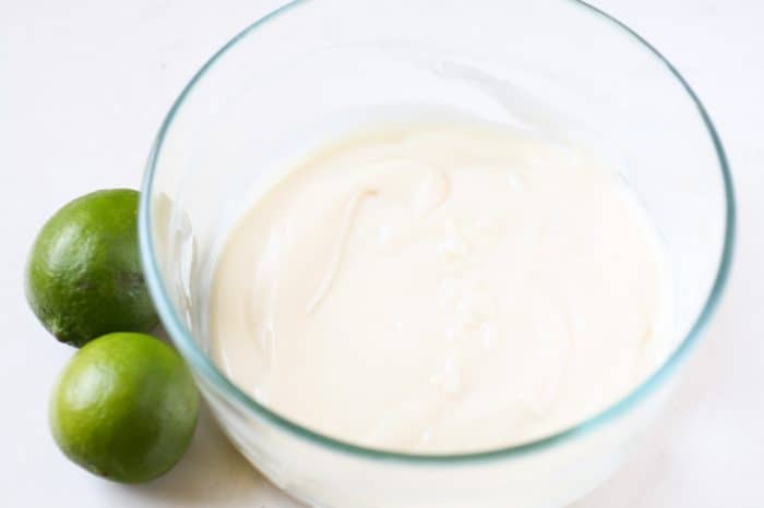 sweetened condensed milk and lime juice in a bowl