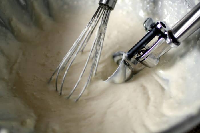 chipa batter in a bowl with a whisk