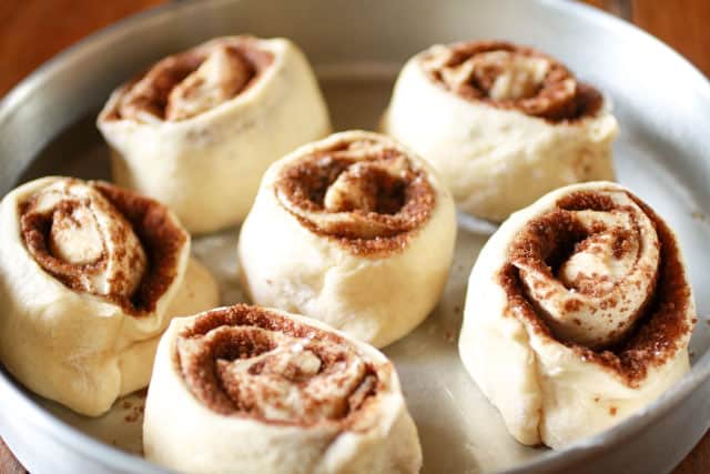 Cinnamon Rolls in a round pan before rising. 