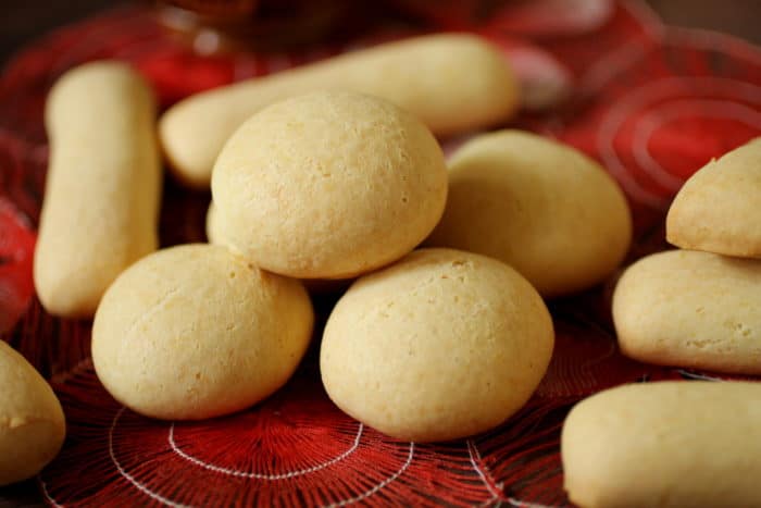 round and stick chipas on a red and white cloth