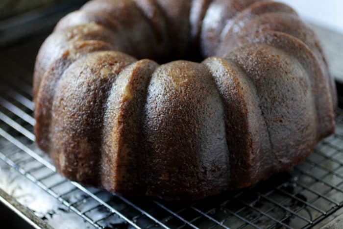 Lemon bundt cake with ginger and black pepper on a rack