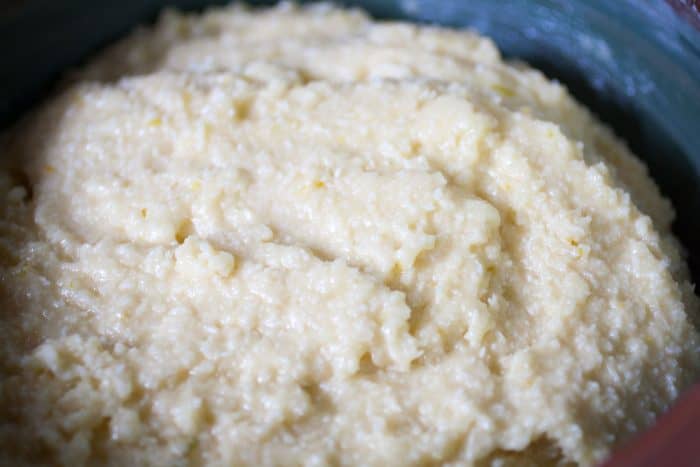 Dough for Ghreyba (Coconut Moroccan Cookies) in a blue bowl.