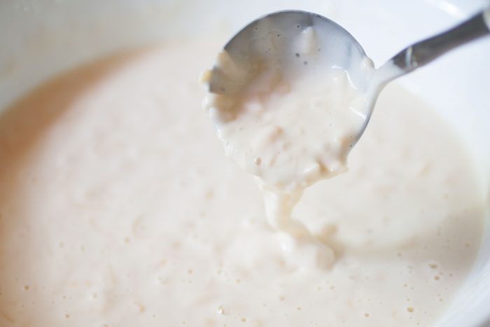 batter for cheese waffles in a white bowl