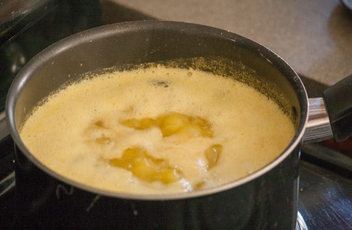 small black pot simmering butter.