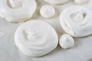 baked mini meringues on baking tray