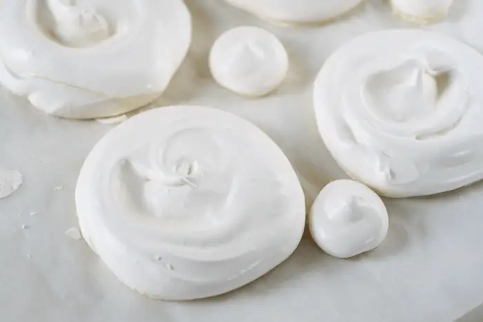 baked mini meringues on baking tray