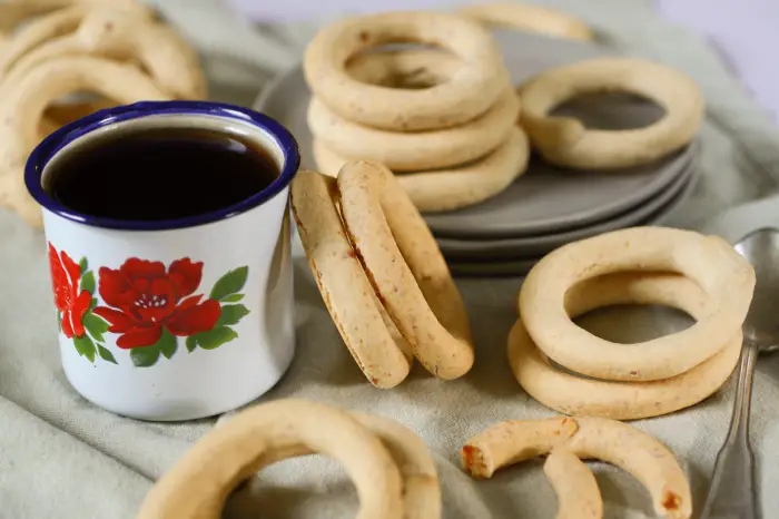 cup of coffee with cuñapé surrounding it