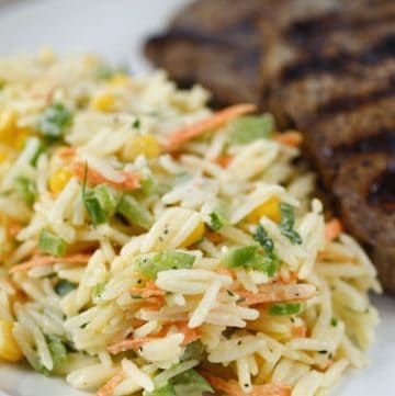 close up of rice salad and steak