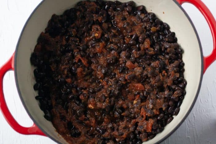 pot with black beans and a jar of salsa