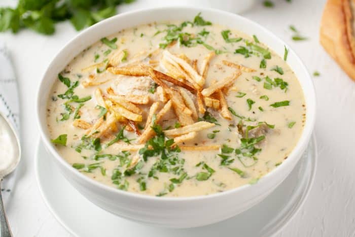 bowl with peanut soup and fries