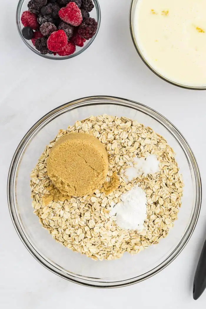 bowl with oats, sugar, baking powder, and salt.