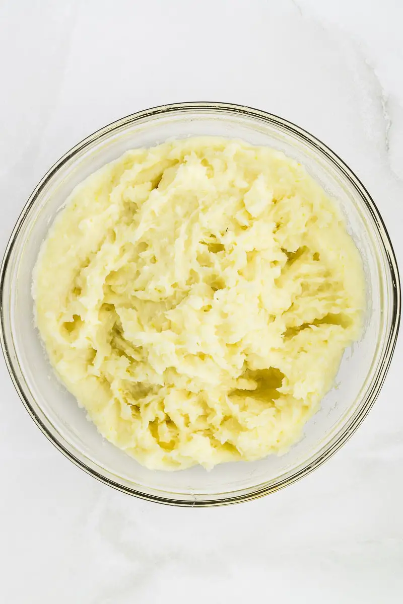 mashed yuca in a clear bowl